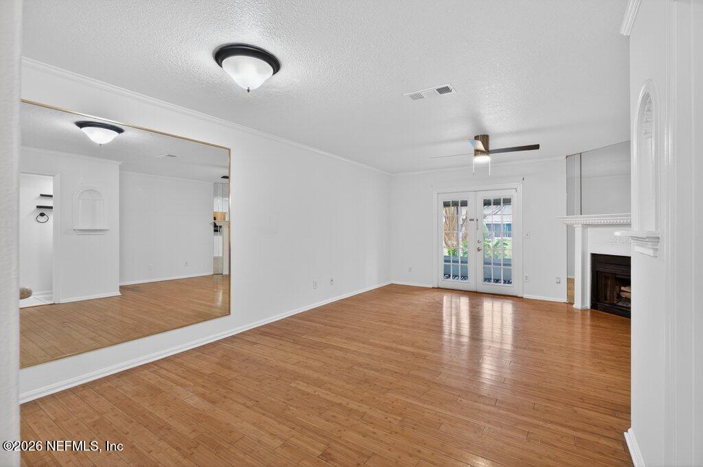 3801 Crown Point Road, Unit 2072 Jacksonville, FL 32257 - Photo 15 of 38 a view of an empty room with window and wooden floor