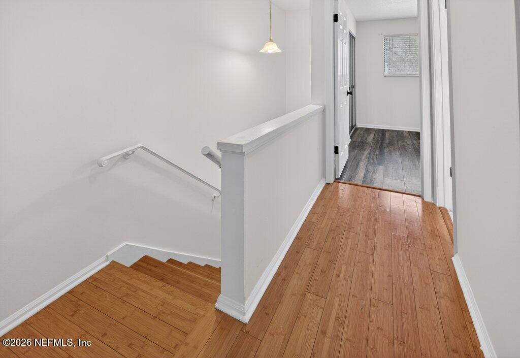 3801 Crown Point Road, Unit 2072 Jacksonville, FL 32257 - Photo 25 of 38 a view of a hallway with wooden floor