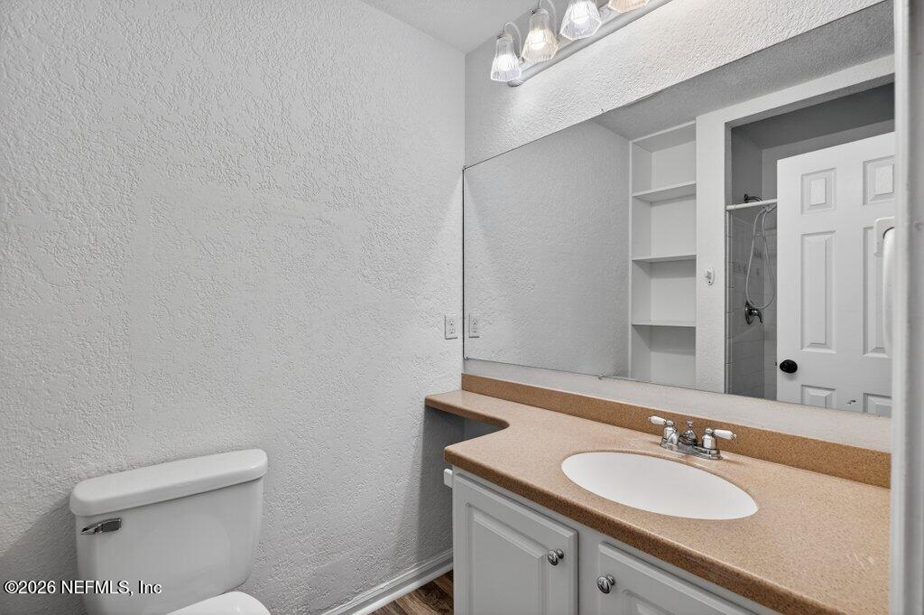 3801 Crown Point Road, Unit 2072 Jacksonville, FL 32257 - Photo 33 of 38 a bathroom with a sink and a toilet