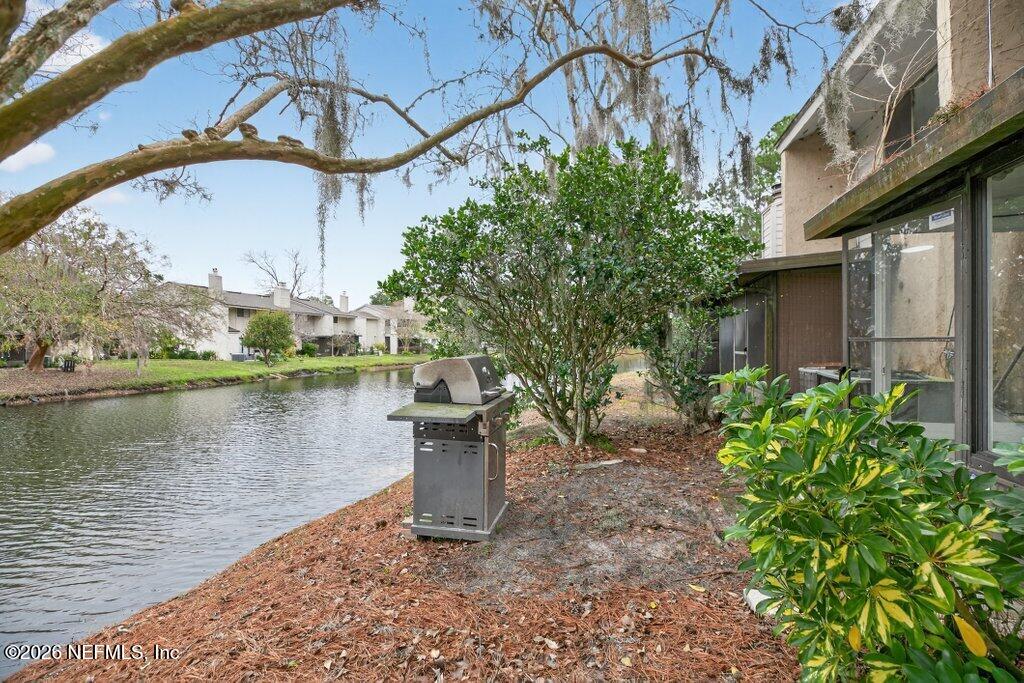 3801 Crown Point Road, Unit 2072 Jacksonville, FL 32257 - Photo 37 of 38 a view of a chair and table on the terrace