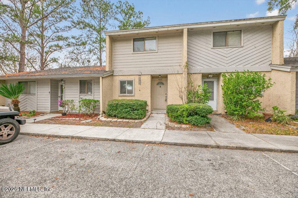 3801 Crown Point Road, Unit 2072 Jacksonville, FL 32257 - Photo 7 of 38 front view of a house with a yard