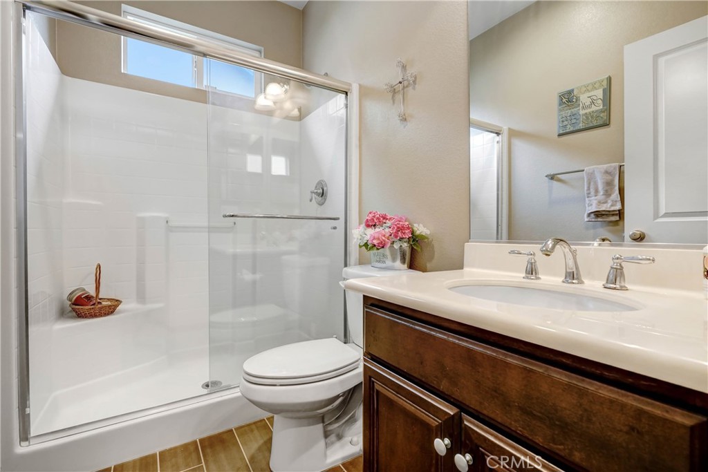 44260 Nighthawk Pass Temecula, CA 92592 - Photo 17 of 55 a bathroom with a sink a toilet and shower