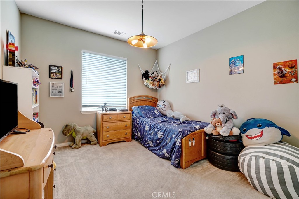 44260 Nighthawk Pass Temecula, CA 92592 - Photo 24 of 55 a bedroom with bed and a window
