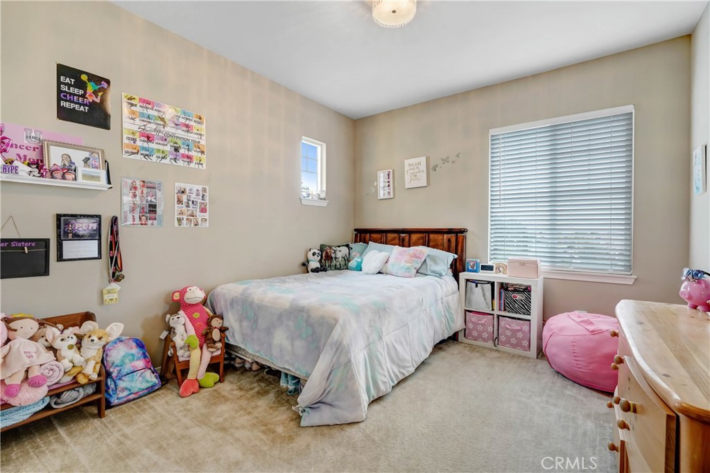 44260 Nighthawk Pass Temecula, CA 92592 - Photo 25 of 55 a bedroom with a bed and a window