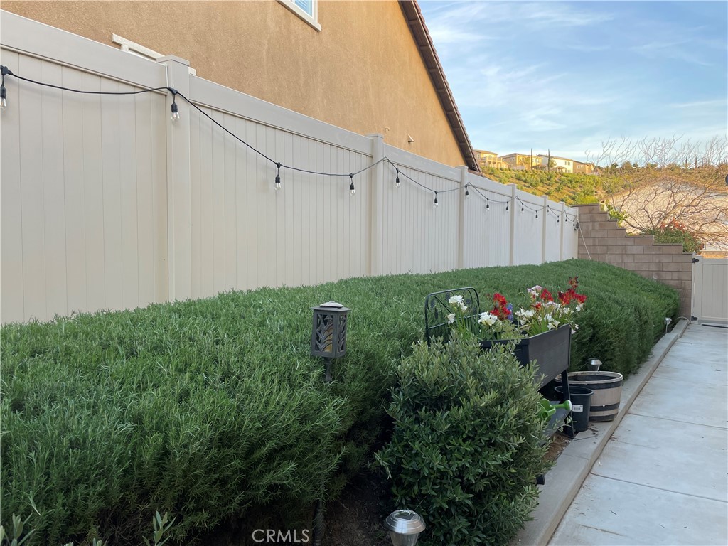 44260 Nighthawk Pass Temecula, CA 92592 - Photo 33 of 55 a view of a backyard with potted plants