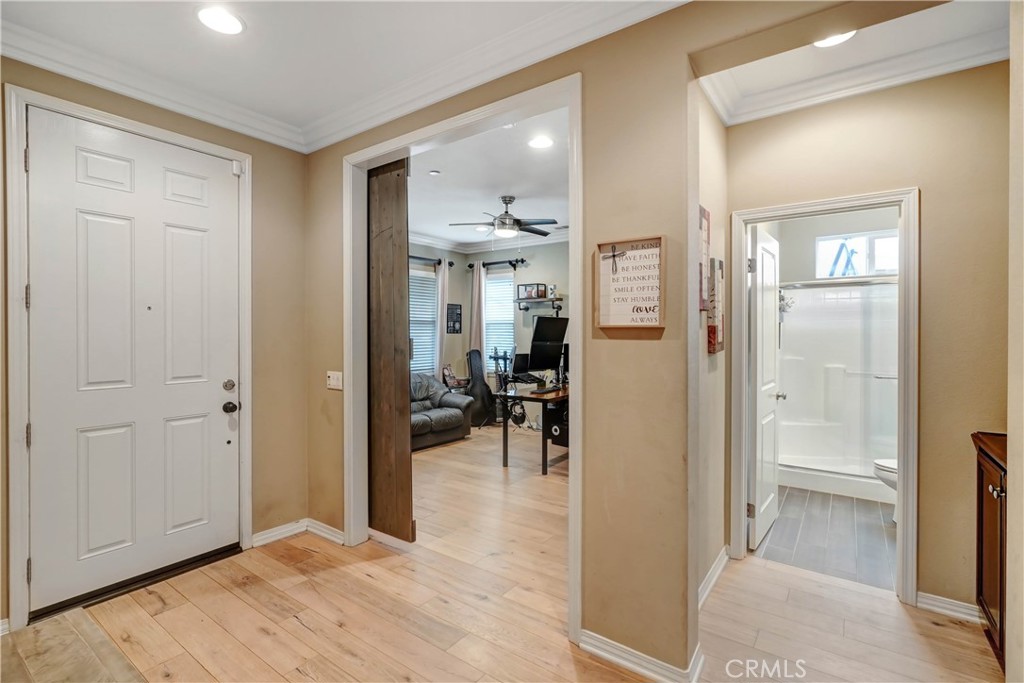 44260 Nighthawk Pass Temecula, CA 92592 - Photo 4 of 55 a view of livingroom with a flat screen tv and refrigerator