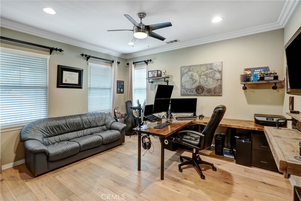 44260 Nighthawk Pass Temecula, CA 92592 - Photo 5 of 55 a work room with furniture and a ceiling fan