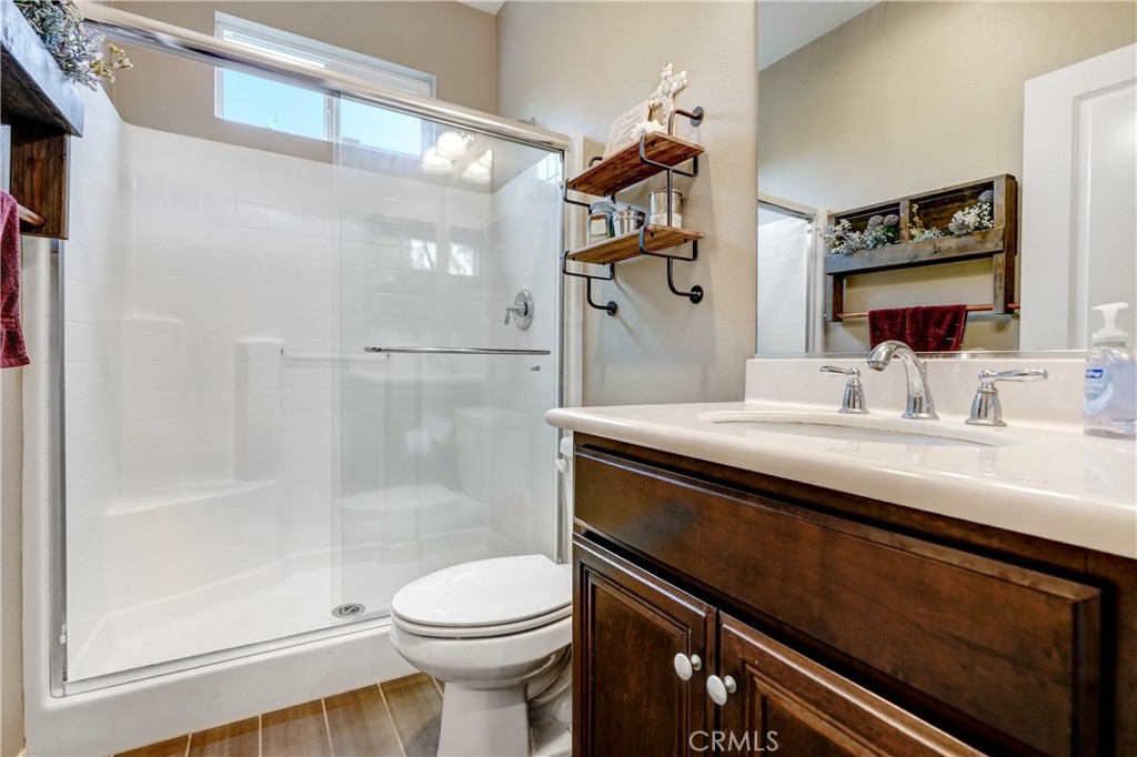 44260 Nighthawk Pass Temecula, CA 92592 - Photo 6 of 55 a bathroom with a sink a toilet and shower