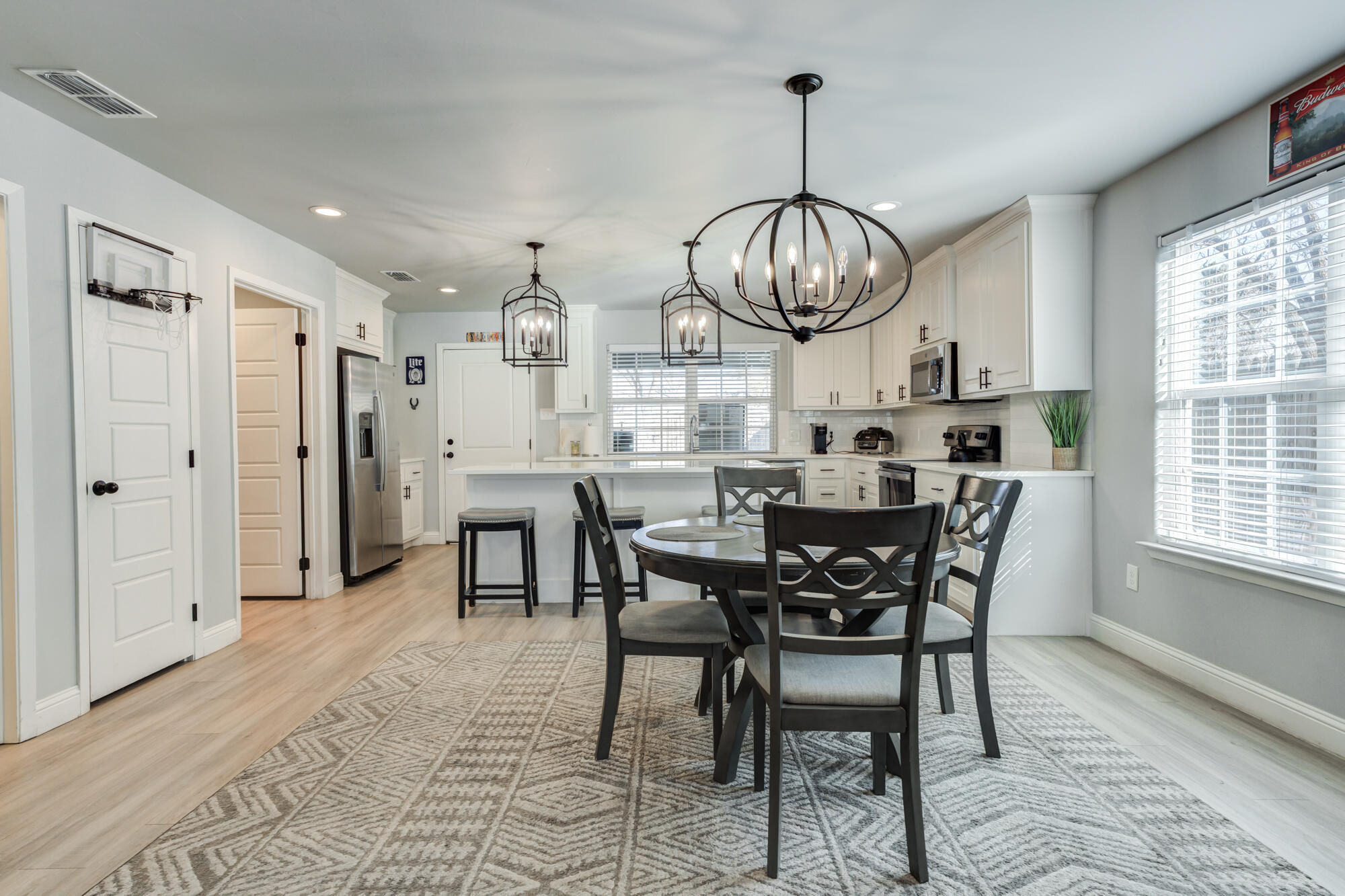 2414 25th Street Lubbock, TX 79411 - Photo 13 of 61 a view of a dining room with furniture window and wooden floor