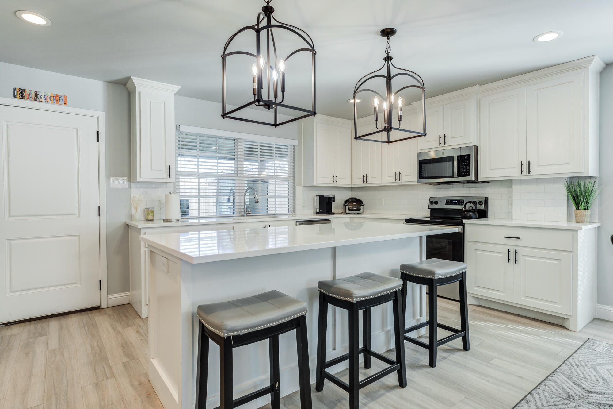 2414 25th Street Lubbock, TX 79411 - Photo 15 of 61 a kitchen with stainless steel appliances granite countertop a sink a stove and a refrigerator