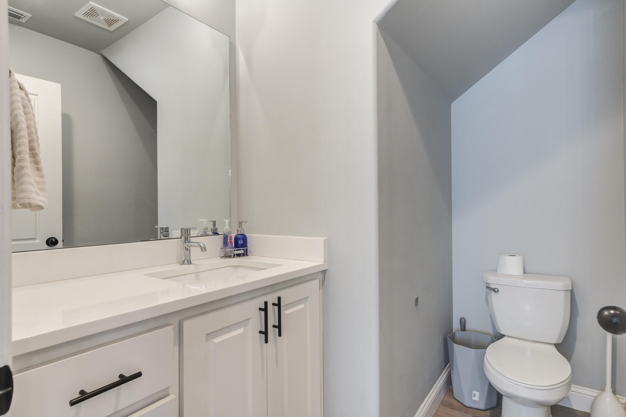 2414 25th Street Lubbock, TX 79411 - Photo 22 of 61 a bathroom with a sink toilet and vanity