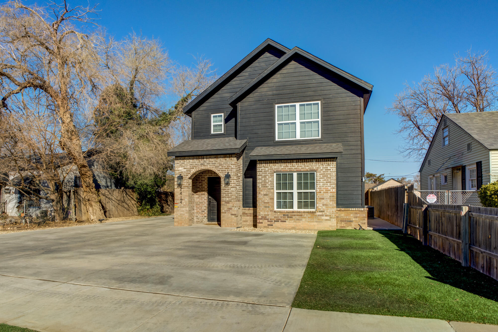 2414 25th Street Lubbock, TX 79411 - Photo 3 of 61 a front view of a house with a yard
