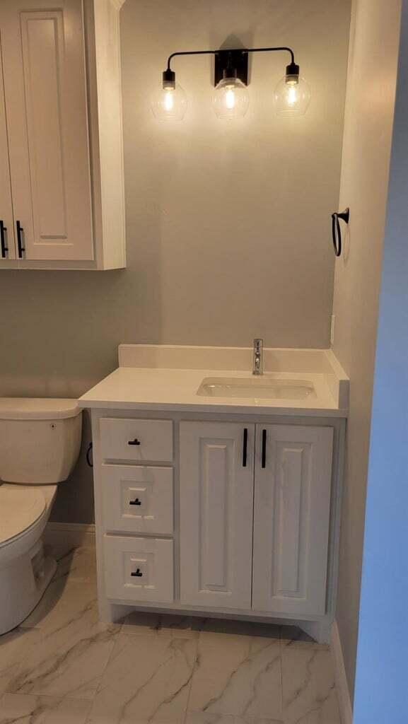 2414 25th Street Lubbock, TX 79411 - Photo 39 of 61 a bathroom with a sink and vanity