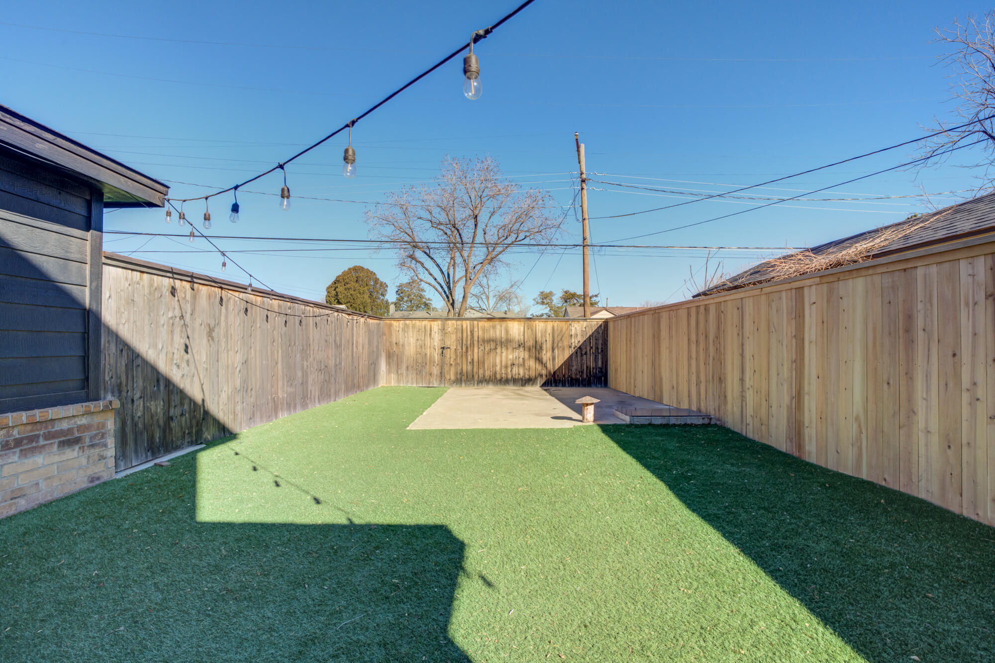 2414 25th Street Lubbock, TX 79411 - Photo 43 of 61 a view of a backyard with a cabin