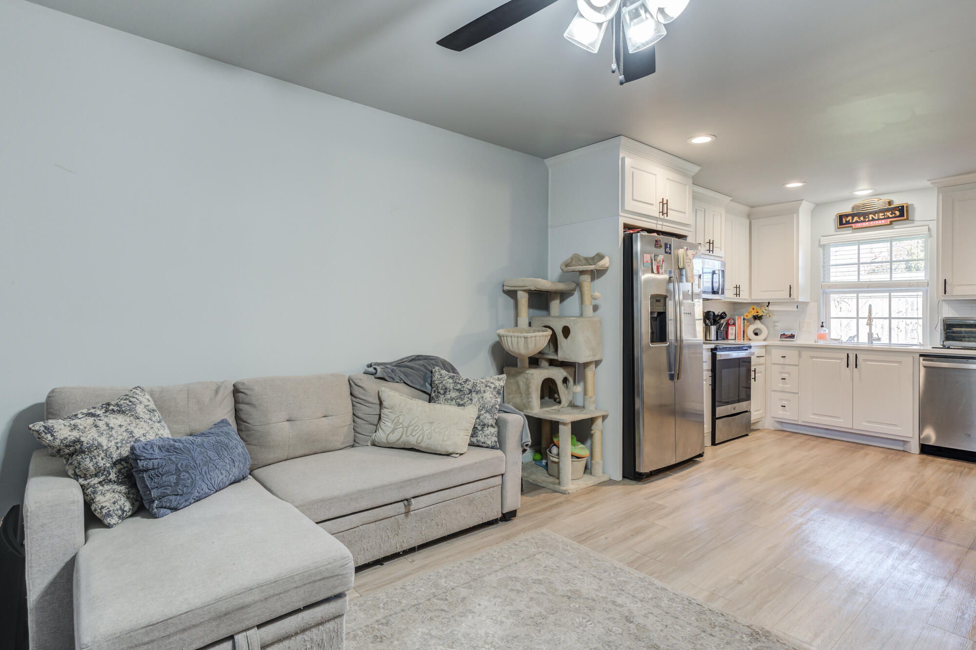 2414 25th Street Lubbock, TX 79411 - Photo 45 of 61 a living room with furniture and kitchen view