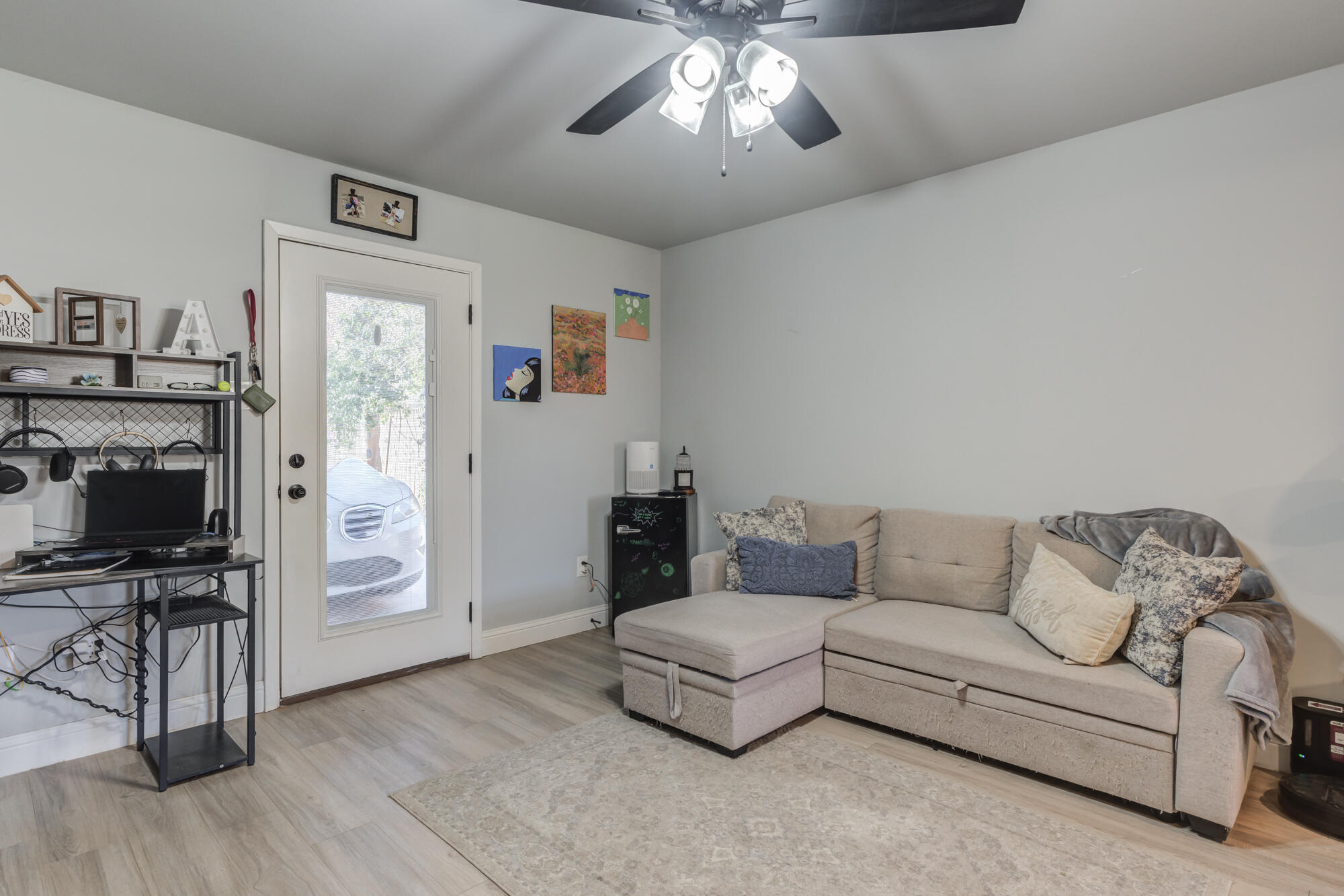 2414 25th Street Lubbock, TX 79411 - Photo 47 of 61 a living room with furniture and a flat screen tv