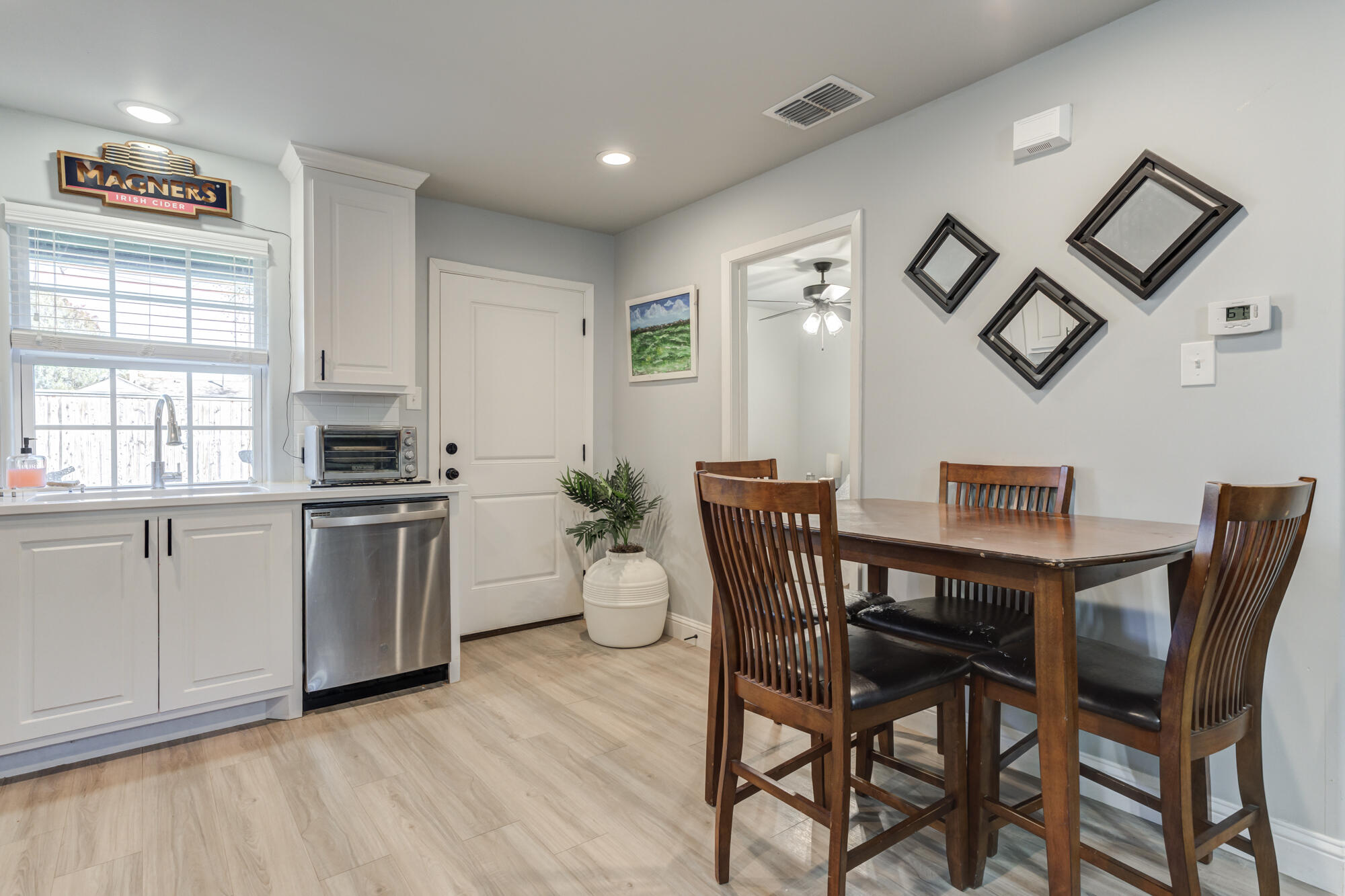 2414 25th Street Lubbock, TX 79411 - Photo 50 of 61 a view of a dining room with furniture and wooden floor