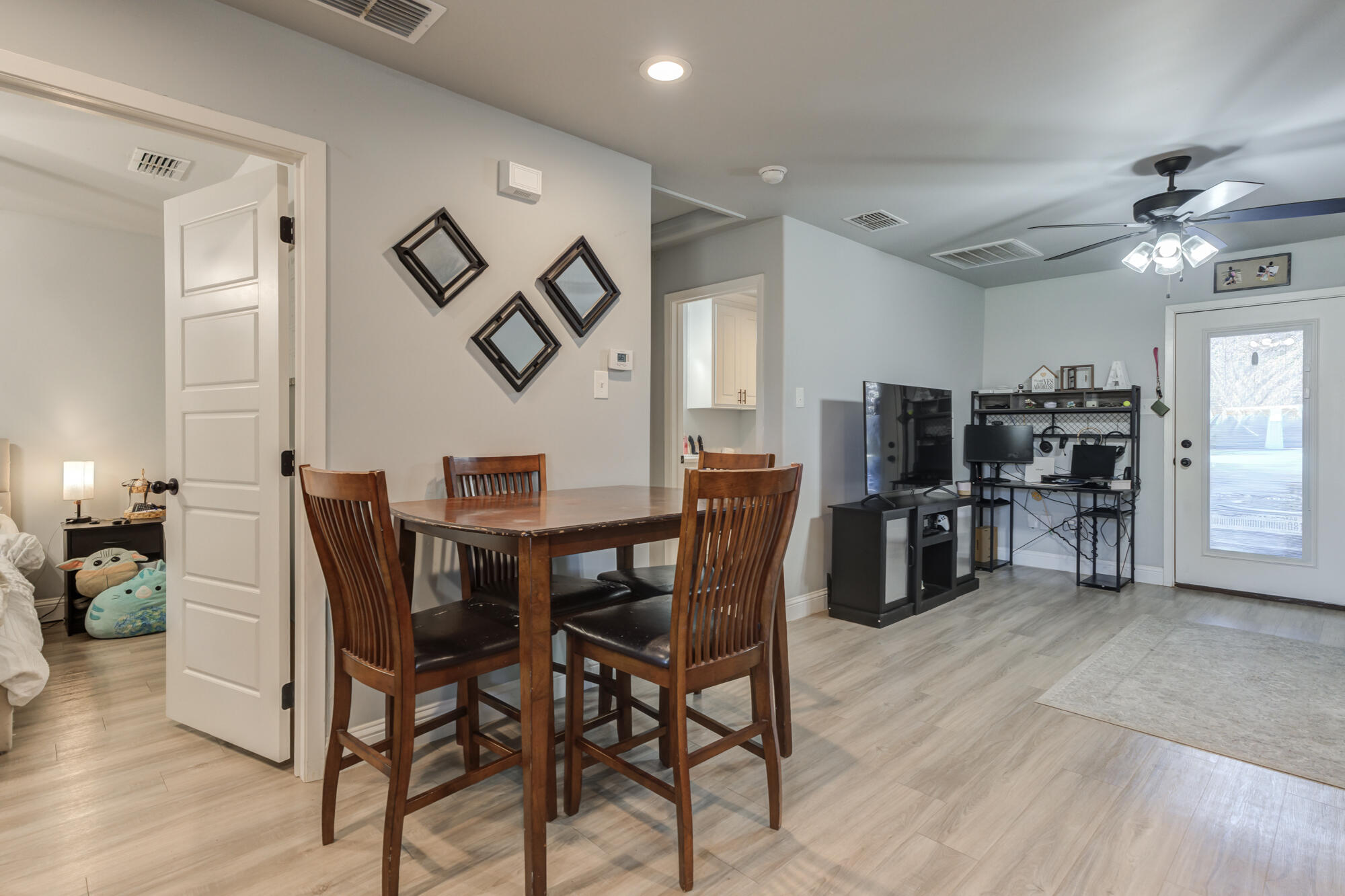 2414 25th Street Lubbock, TX 79411 - Photo 54 of 61 a view of a dining room with furniture and chandelier