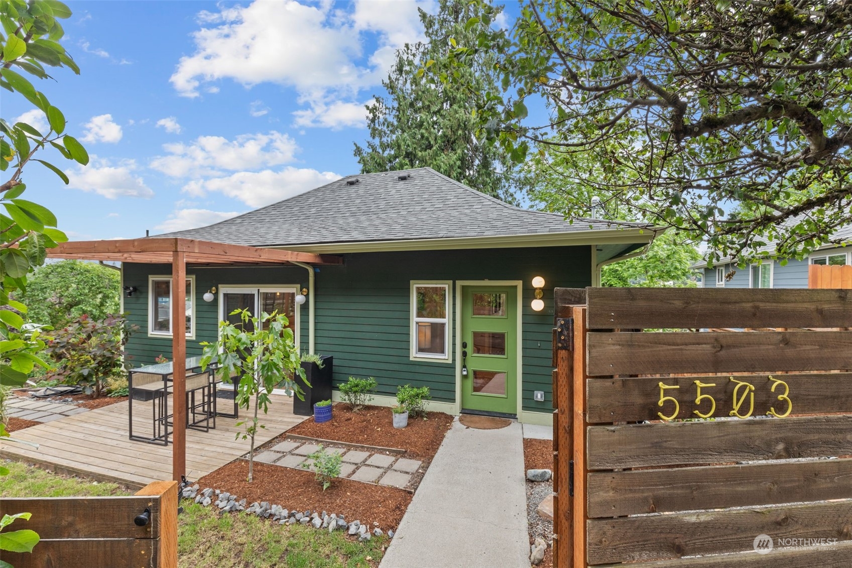 5503 Renton Avenue South Seattle, WA 98118 - Photo 1 of 39 a front view of a house with garden
