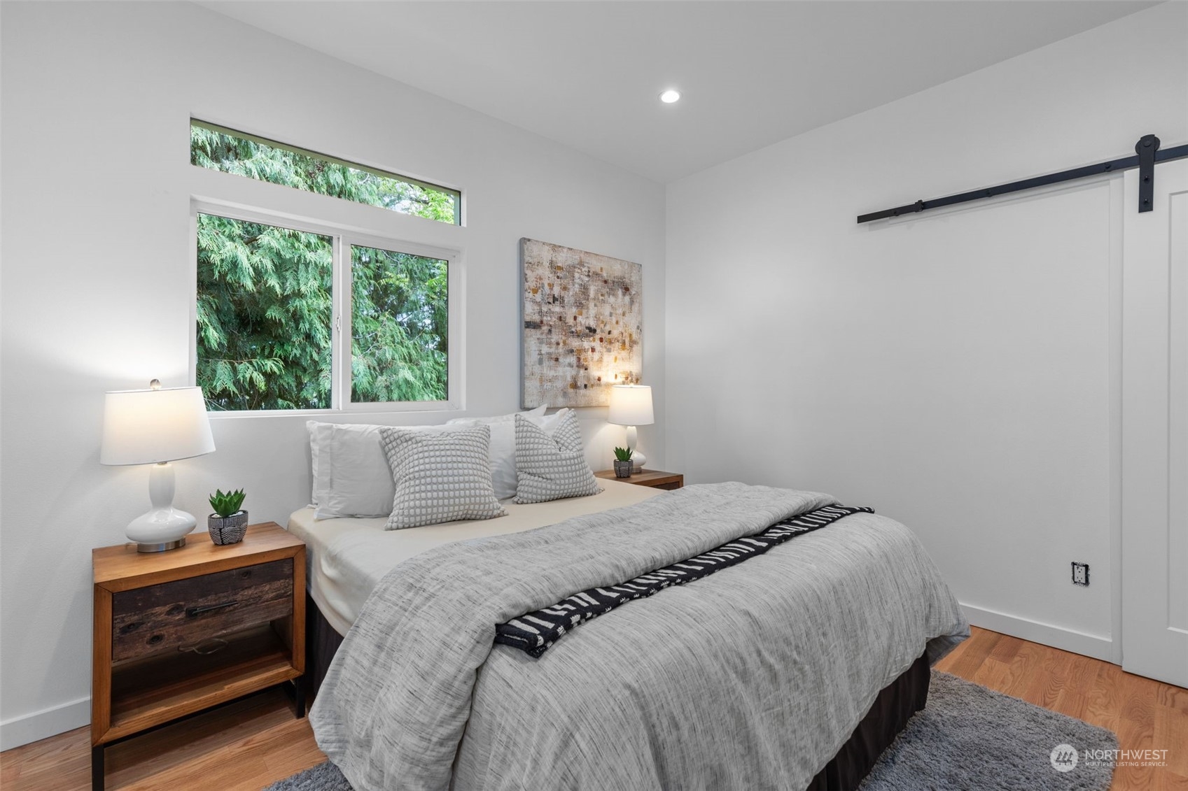 5503 Renton Avenue South Seattle, WA 98118 - Photo 18 of 39 a bedroom with a bed window and table