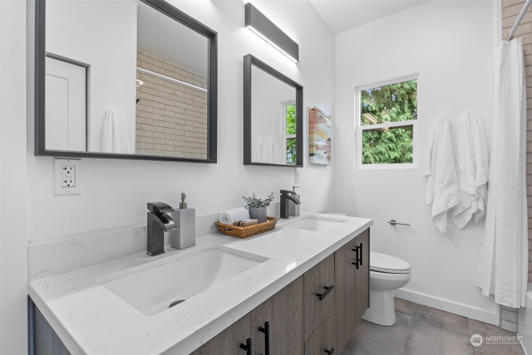 5503 Renton Avenue South Seattle, WA 98118 - Photo 21 of 39 a bathroom with a sink a toilet and a mirror