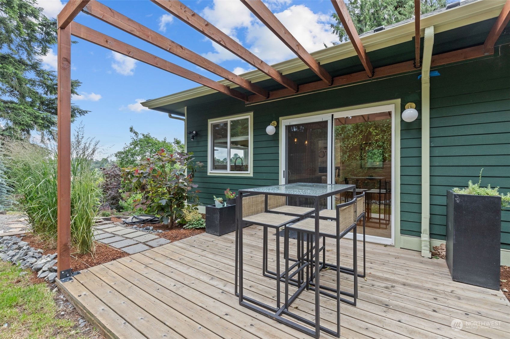 5503 Renton Avenue South Seattle, WA 98118 - Photo 24 of 39 a patio with wooden floor and outdoor seating