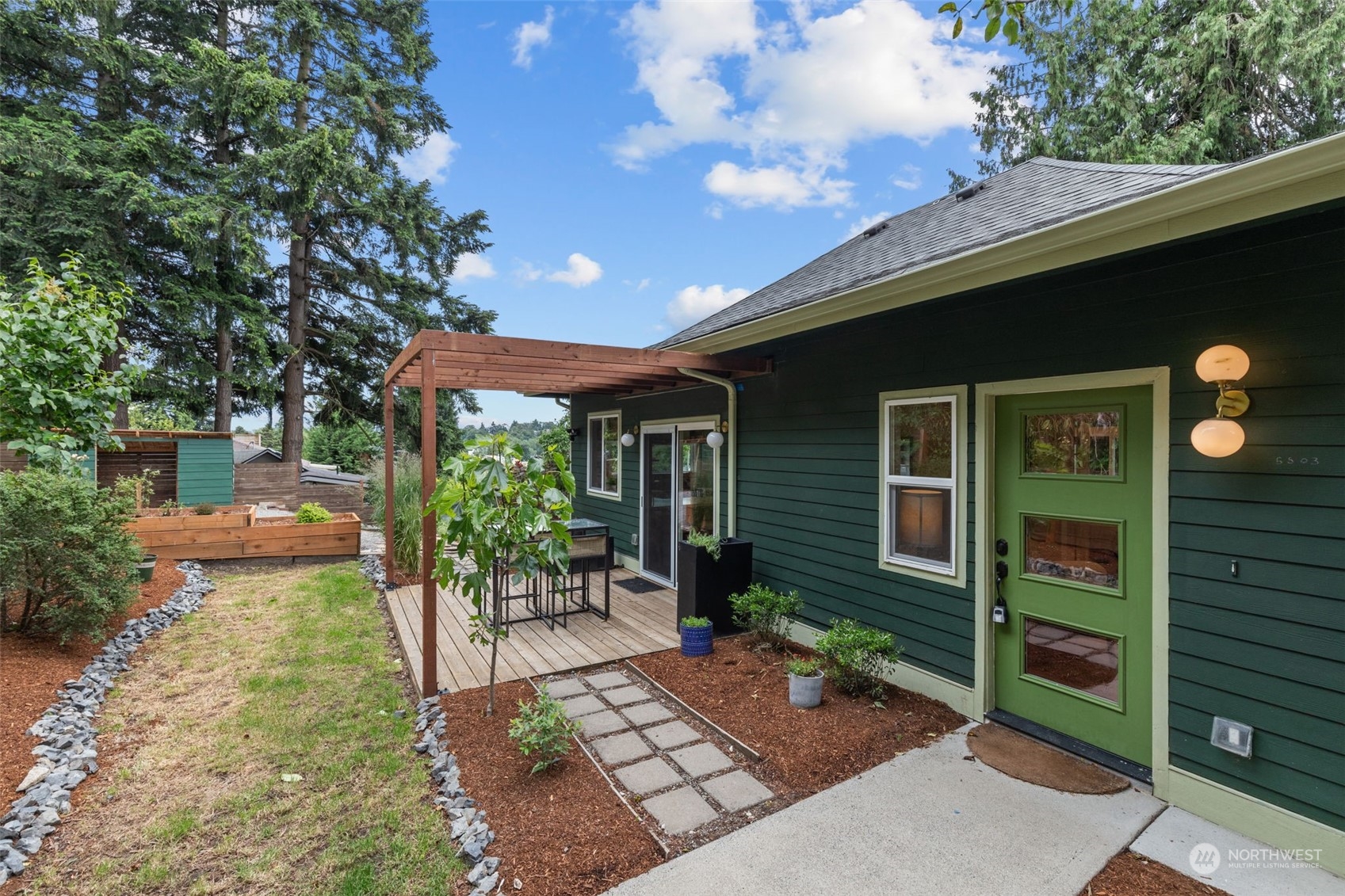 5503 Renton Avenue South Seattle, WA 98118 - Photo 26 of 39 a front view of a house with garden