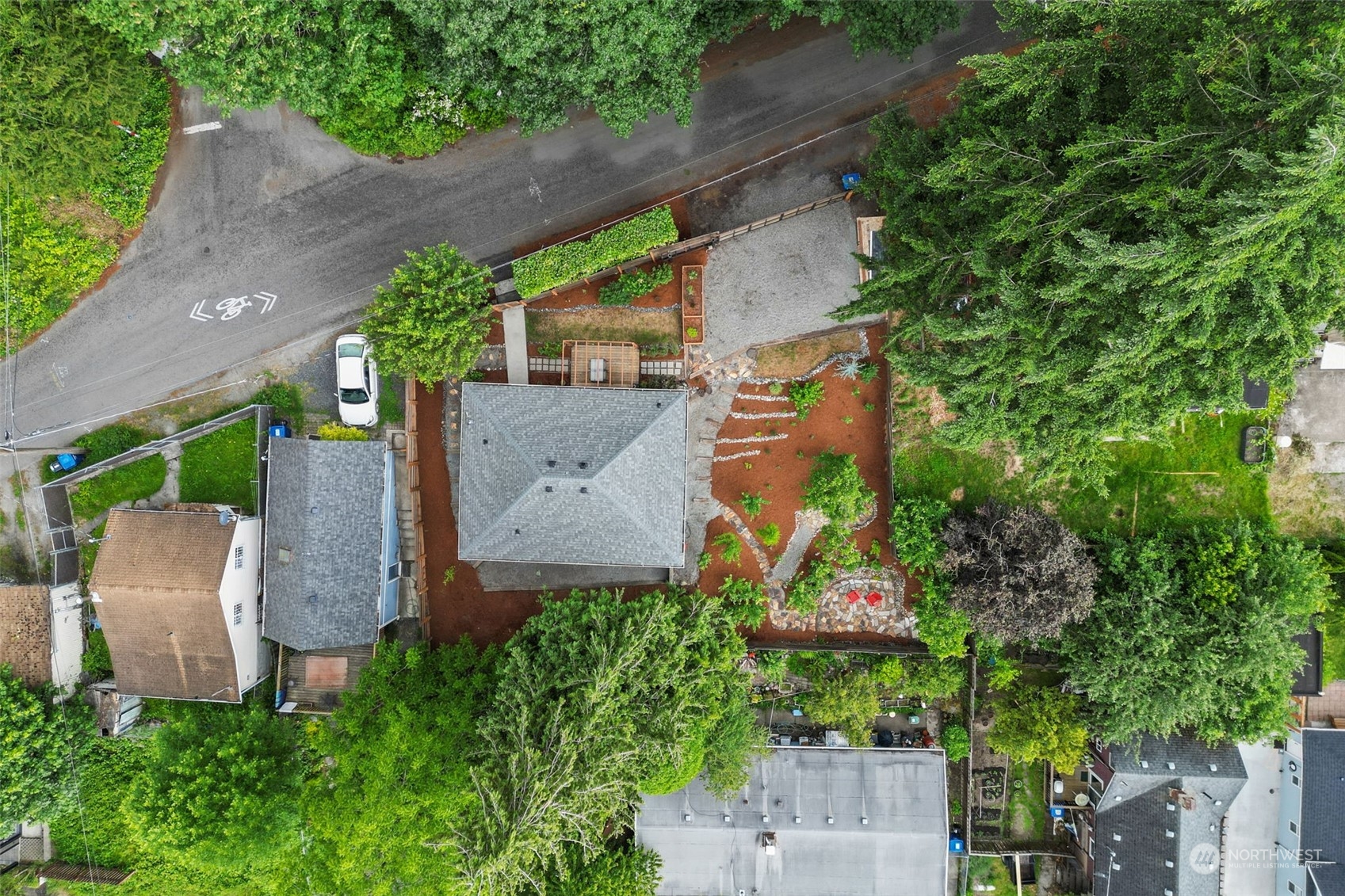 5503 Renton Avenue South Seattle, WA 98118 - Photo 38 of 39 an aerial view of a house with garden space and a bench