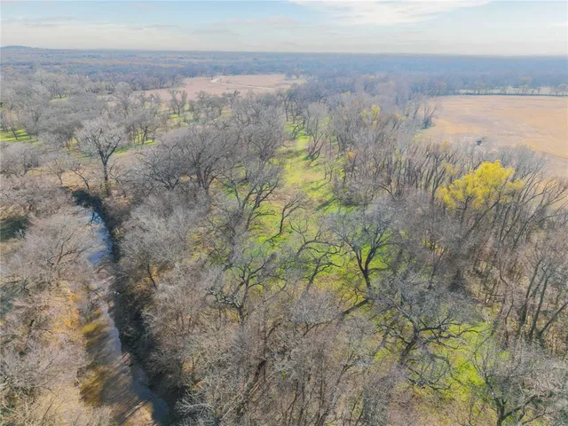 a swimming pool with an outdoor space and seating area