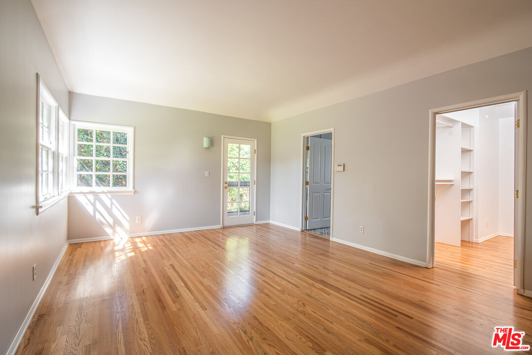 11144 Valley Spring Place Studio City, CA 91602 - Photo 15 of 36 wooden floor in an empty room with a window