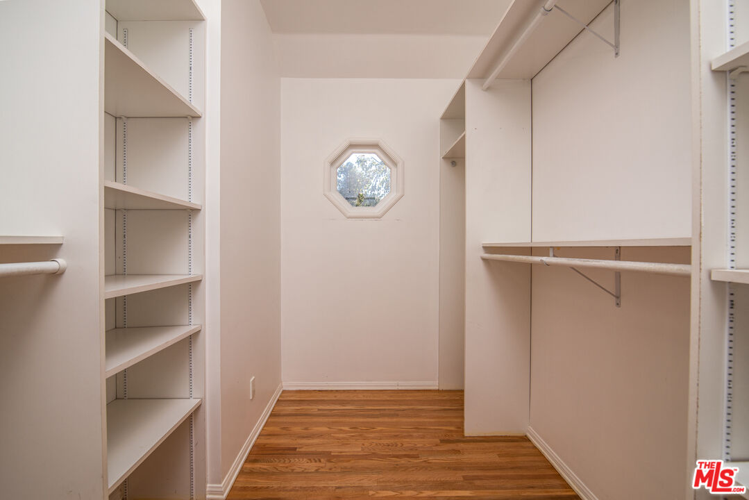 11144 Valley Spring Place Studio City, CA 91602 - Photo 16 of 36 a view of an empty room with wooden floor