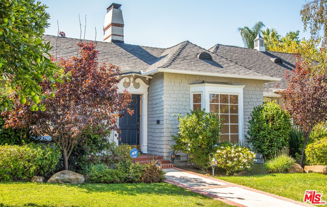 11144 Valley Spring Place Studio City, CA 91602 - Photo 2 of 36 a front view of a house with garden