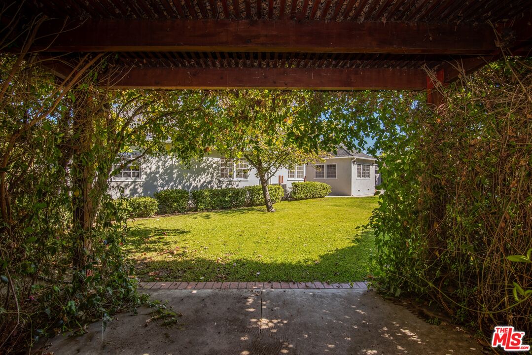11144 Valley Spring Place Studio City, CA 91602 - Photo 34 of 36 a view of a swimming pool with an outdoor seating area