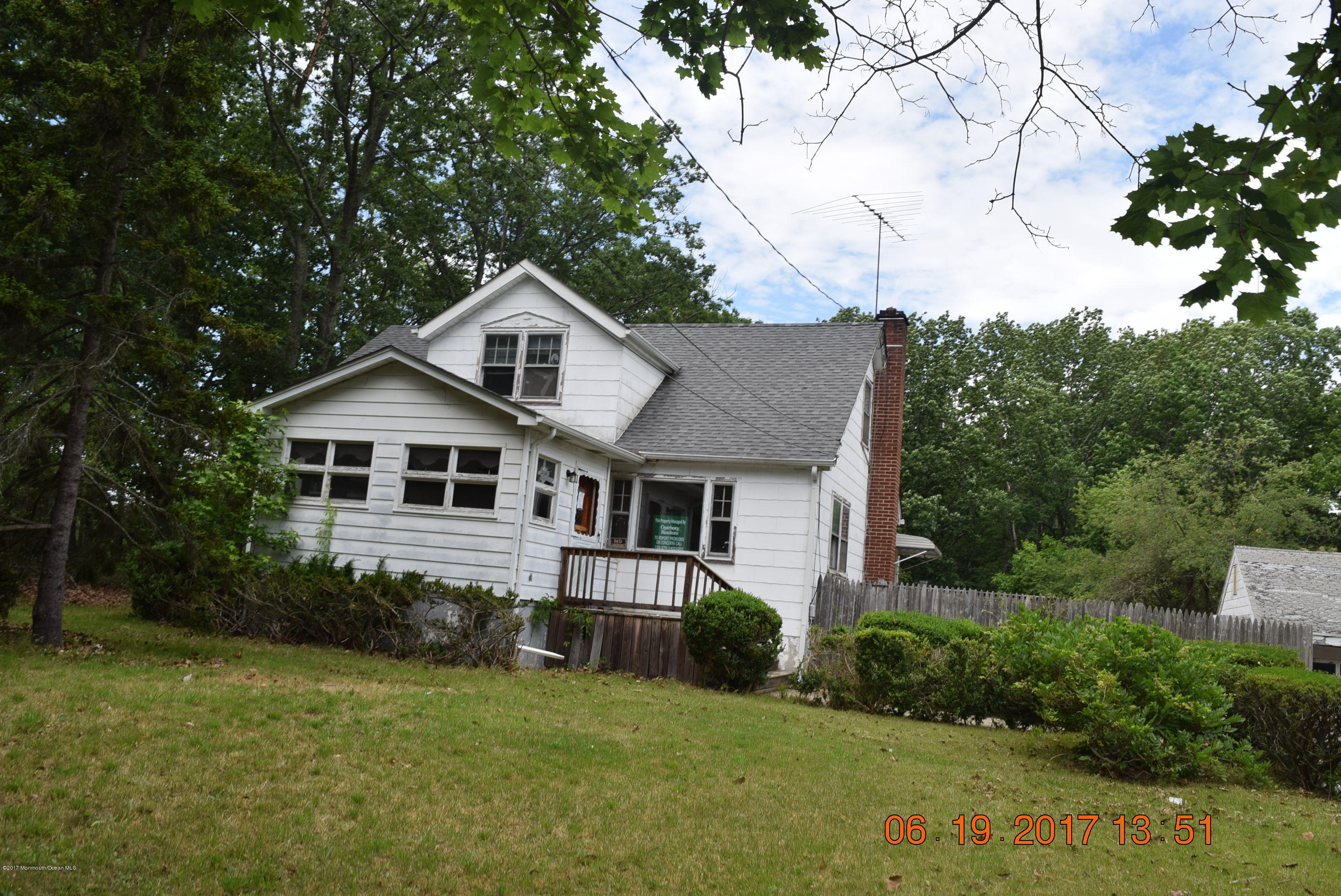 636 West Farms Road Howell, NJ 07731 - Photo 1 of 17 a front view of a house with a yard