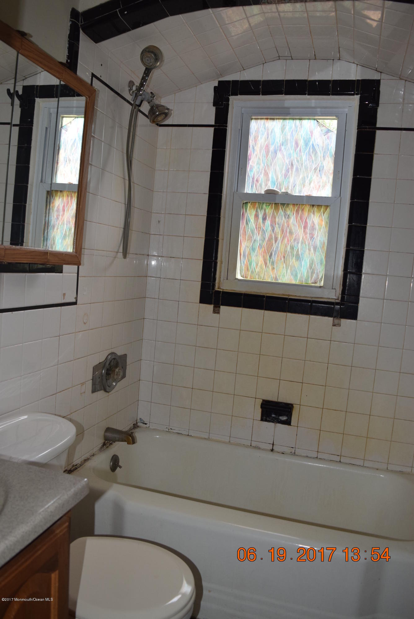 636 West Farms Road Howell, NJ 07731 - Photo 9 of 17 a bathroom with a toilet a sink and a bathtub