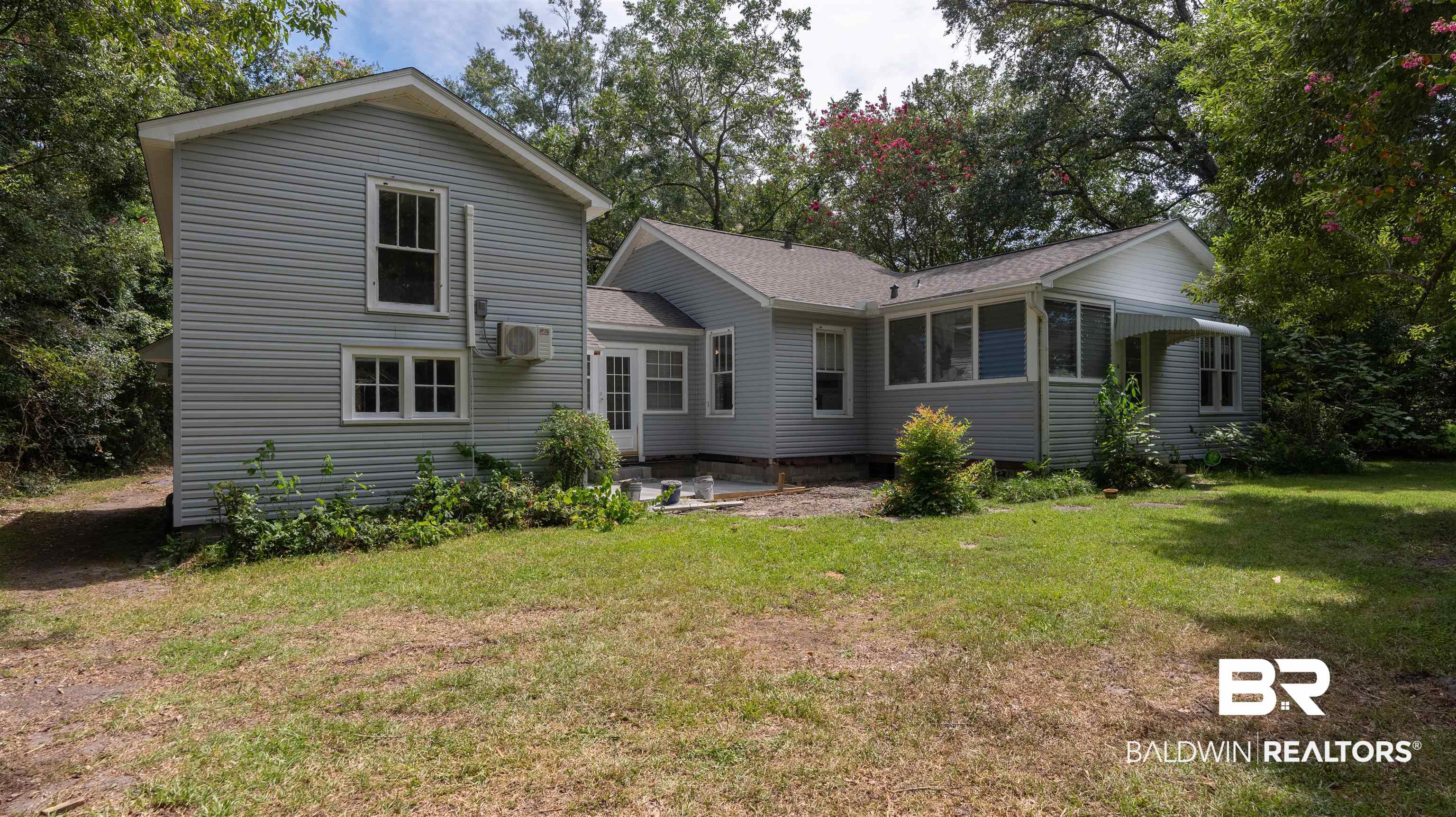 2126 Barron Place Mobile, AL 36605 - Photo 26 of 33 Rear view of house featuring a yard