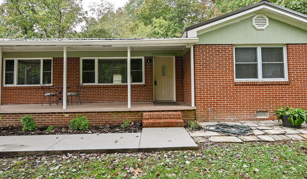 5024 Spring Place Road Southeast Cleveland, TN 37323 - Photo 10 of 43 a front view of a house with garden