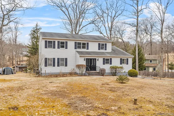 a front view of a house with yard patio and fire pit