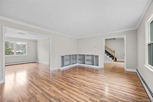 a view of a livingroom with wooden floor