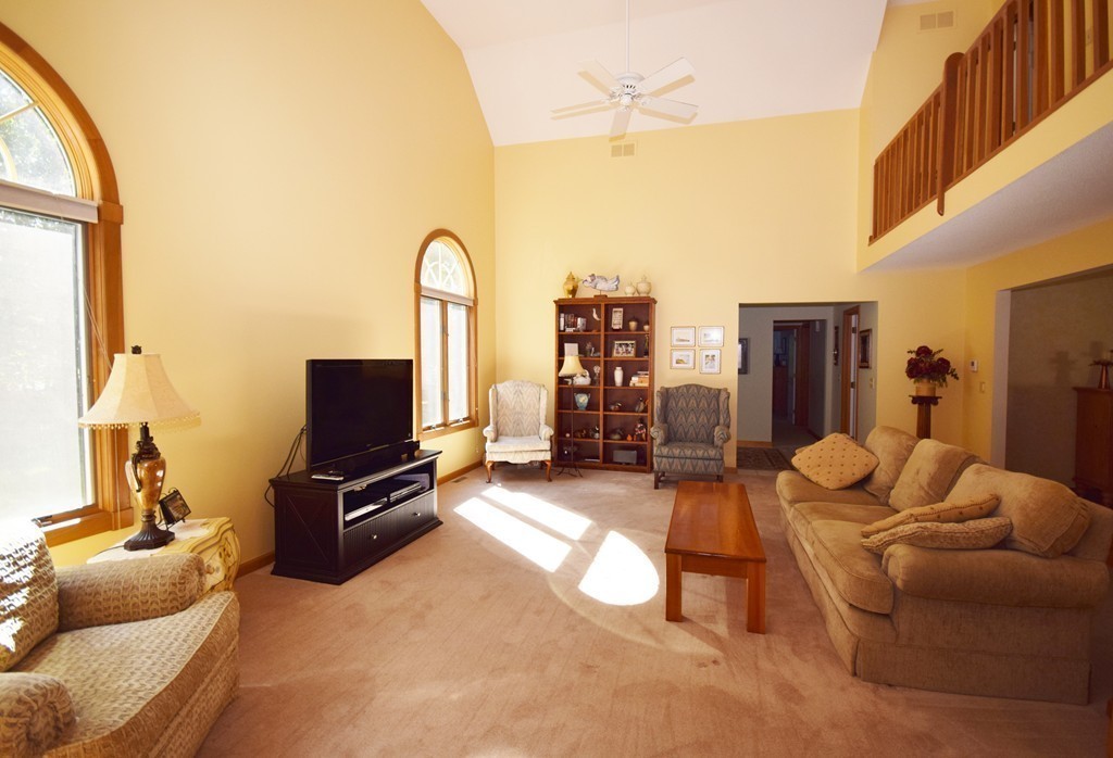 222 Somers Road Hampden, MA 01036 - Photo 18 of 30 a living room with furniture a flat screen tv and a large window