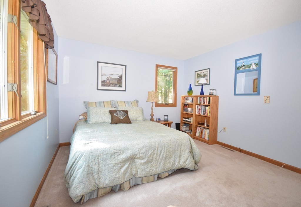 222 Somers Road Hampden, MA 01036 - Photo 21 of 30 a bedroom with a bed and a table