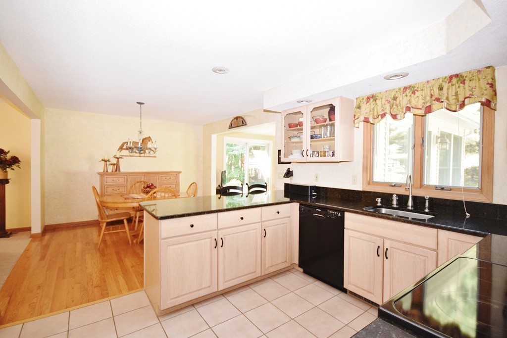 222 Somers Road Hampden, MA 01036 - Photo 3 of 30 a kitchen with granite countertop a sink and white cabinets
