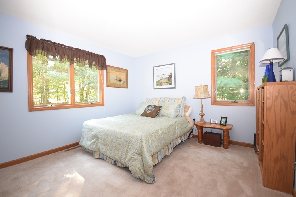 222 Somers Road Hampden, MA 01036 - Photo 8 of 30 a bedroom with a bed and a window