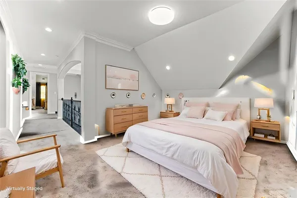 a bedroom with bed and cabinets