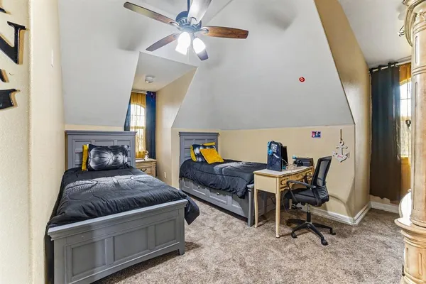 a bedroom with furniture and a window