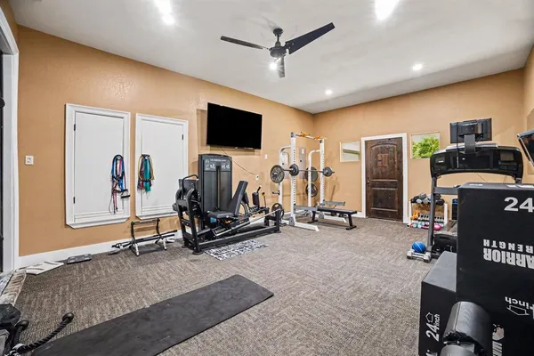 a view of a livingroom with furniture and a flat screen tv