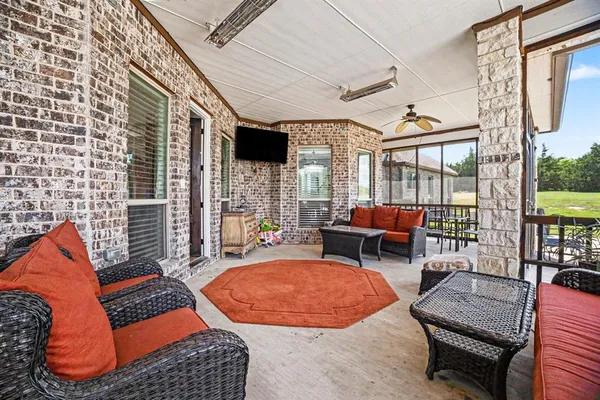 a outdoor space with patio couch and a potted plant