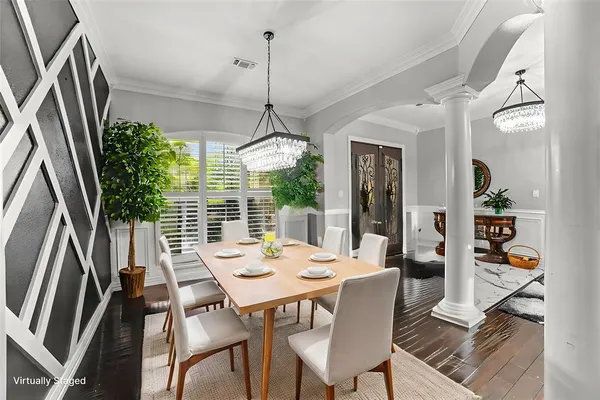 a view of a dining room with furniture window and wooden floor