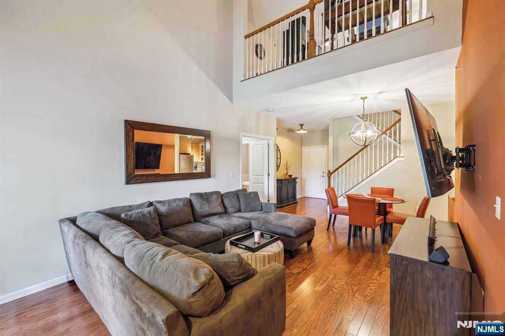 175 Rochelle Avenue, Unit 321 Rochelle Park, NJ 07662 - Photo 11 of 27 a living room with furniture and wooden floor