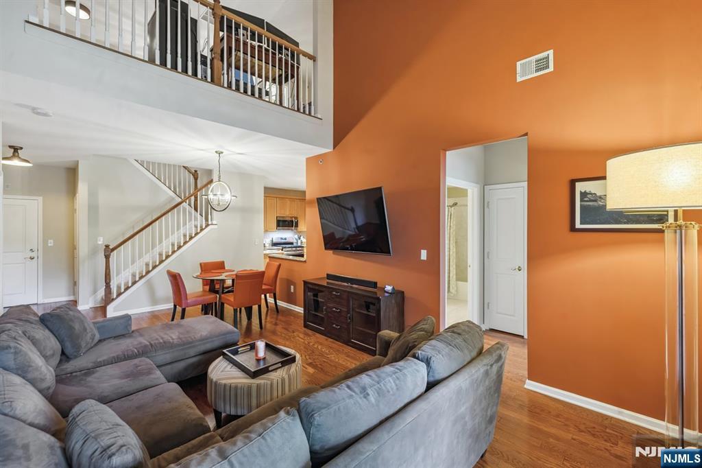 175 Rochelle Avenue, Unit 321 Rochelle Park, NJ 07662 - Photo 12 of 27 a living room with furniture and a flat screen tv
